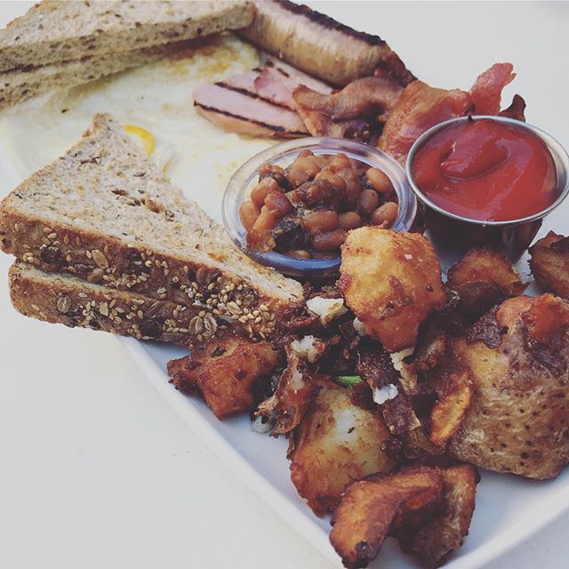 on-the-plate-the-“special”…-all-the-fixin’s-over-easy-eggs-ham-sausage-bacon-home-fries-bake